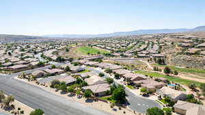 Aerial view of residential area with a mountainous background