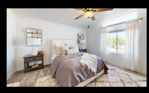 Carpeted bedroom featuring baseboards and ceiling fan