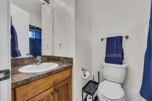 Bathroom featuring vanity and toilet