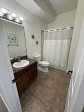 Full bath featuring vanity and tile patterned floors
