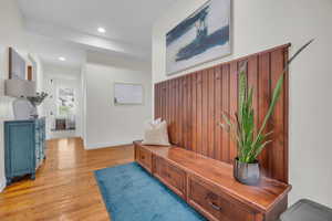 Mudroom featuring light wood-style flooring and recessed lighting