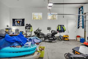 Garage featuring a garage door opener