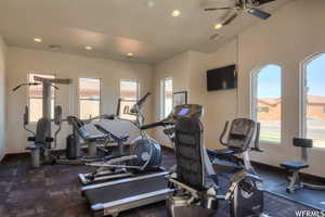 Exercise room featuring plenty of natural light, a ceiling fan, recessed lighting, and vaulted ceiling