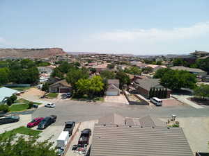 Aerial view of residential area featuring a mountain backdrop