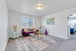 Living area featuring carpet flooring