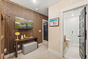Full bath featuring a tile shower and vanity