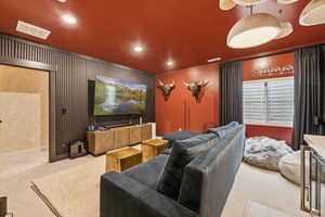 Cinema room featuring carpet and recessed lighting