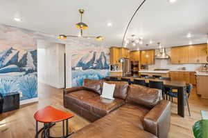 Living area featuring light wood-type flooring and recessed lighting