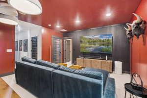 Home theater with recessed lighting and baseboards