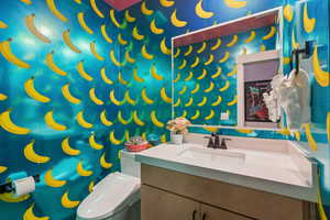 Bathroom with vanity and toilet