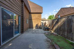 Fenced backyard featuring a patio