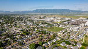 Aerial view of property and surrounding area with mountains