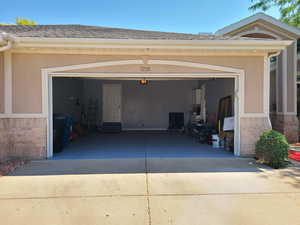 Garage featuring driveway