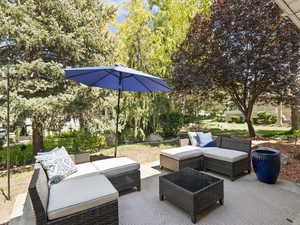 View of patio with an outdoor hangout area