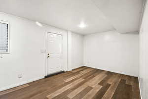 Below grade area with wood finished floors and baseboards