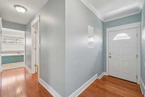 Entrance foyer with wood finished floors and plenty of natural light