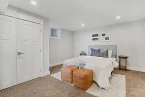 Carpeted bedroom featuring baseboards and recessed lighting