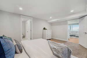 Bedroom with recessed lighting and carpet