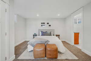 Carpeted bedroom featuring recessed lighting and baseboards