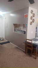 Hallway featuring carpet