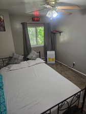 Bedroom featuring carpet floors and ceiling fan