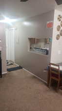Corridor featuring carpet