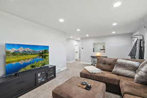 Living room featuring carpet flooring and recessed lighting