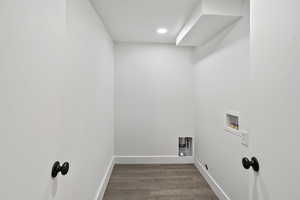 Washroom with washer hookup and wood finished floors