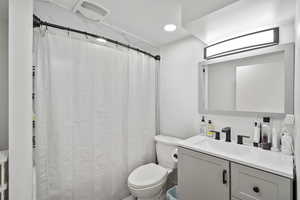 Bathroom with vanity and a shower with curtain