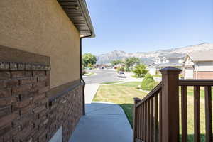View of grassy yard with a mountain view and a residential view
