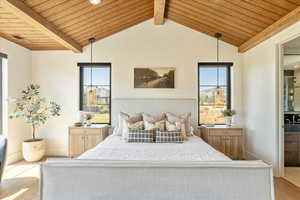 Bedroom with wood finished floors, wooden ceiling, and multiple windows