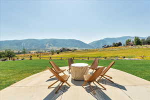 View of patio featuring a mountain view and a rural view