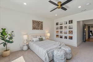 Carpeted bedroom featuring recessed lighting and ceiling fan