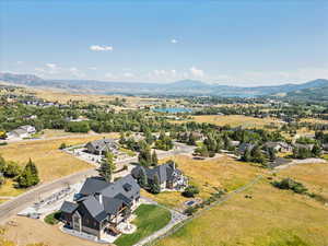 Aerial perspective of suburban area with a water and mountain view