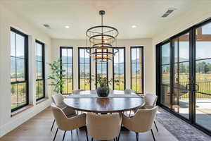 Dining room featuring a chandelier, recessed lighting, and light wood finished floors
