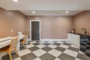 Home office with washer / dryer and recessed lighting