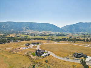 Aerial view of sparsely populated area featuring a mountain backdrop