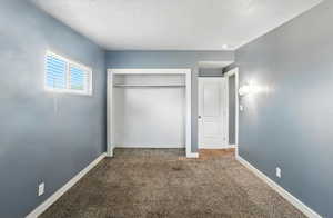 Bedroom with carpet flooring and a closet
