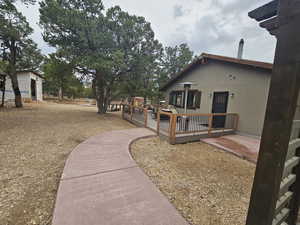 View of home's exterior with a wooden deck