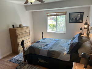 Bedroom featuring wood finished floors and ceiling fan