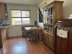 Dining area featuring wood finished floors and healthy amount of natural light