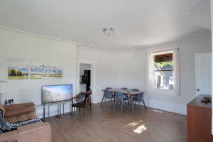 Living area featuring wood finished floors and baseboards