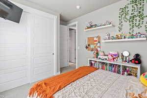 Bedroom featuring a closet and carpet flooring