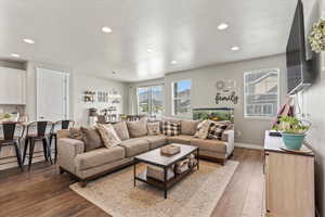 Living area with recessed lighting and wood finished floors