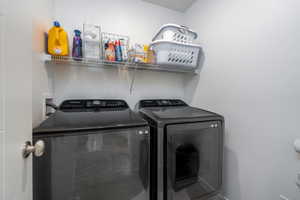 Laundry room with washing machine and dryer