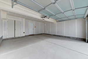 Garage featuring a garage door opener