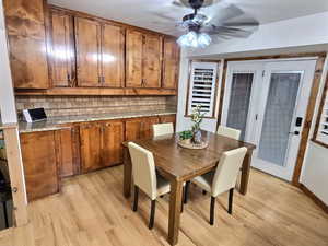 Dining space featuring light wood-style floors and a ceiling fan