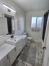 Full bath with vanity and curtained shower