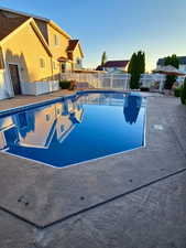 View of swimming pool with a patio area