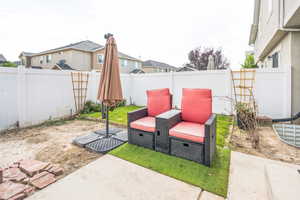 Fenced backyard with a patio area